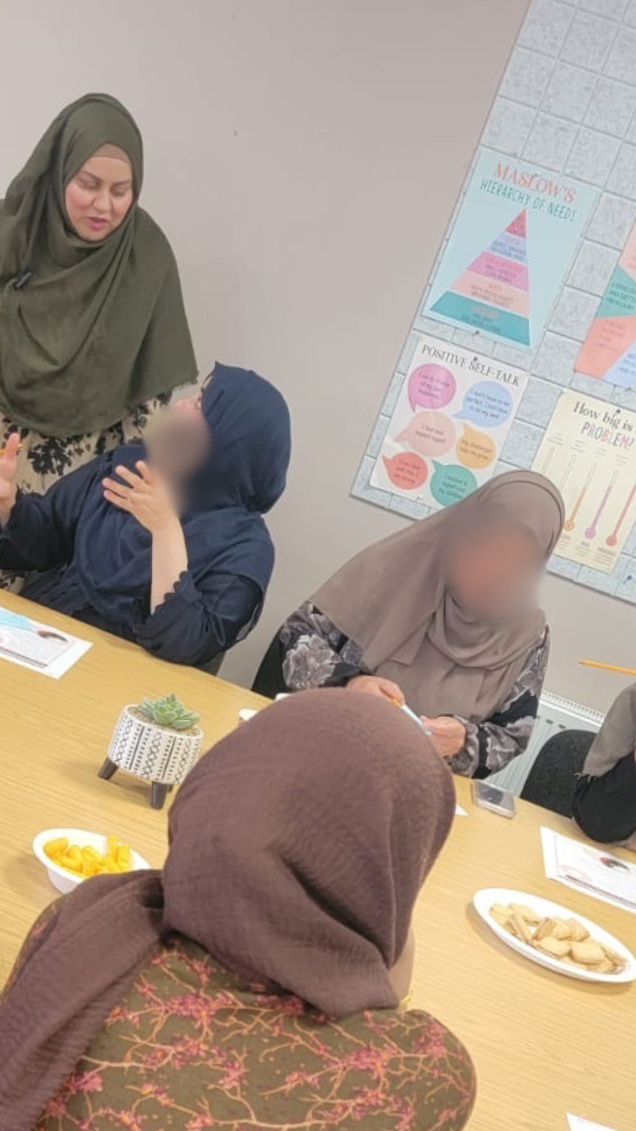 Sofia listening as a participant shares during a group discussion