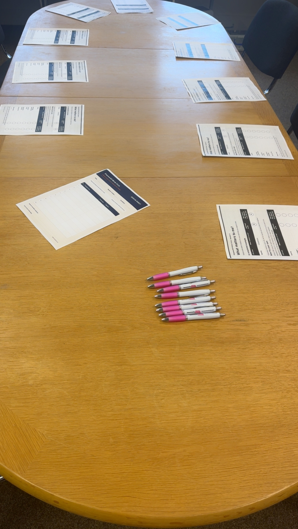 EmpowerED Minds Circle worksheets and pens prepared around a table